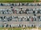 Aerial shot over vehicles at shopping mall parking lot, high angle view looking directly down