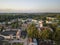 Aerial shot, overview of city center in golden colors, Smiltene, Latvia