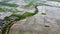 Aerial shot. Paddy field and Furrows row pattern in a plowed field prepared for planting crops in spring