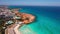 Aerial shot of picturesque azure blue bay in Mediterranean sea on Cyprus. Wide shot calm seascape in sunshine outdoors.