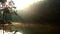 Aerial shot of Rays of sunlight on a lake with campsite. Sunrise at Pang Oung Lake in Thailand