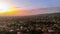 Aerial shot of a residential area in bandung indonesia with sunset in the background