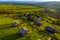 Aerial shot of a resort with several separate rooms in a rural area during daylight