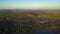 Aerial shot rising over the treetops revealing the Appalachian Mountain Range on a bright day.