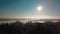 Aerial shot rising up over amazing winter landscape with forest park surrounded by snow