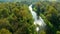 Aerial Shot Of river and trough and trees tinged in autumn colors