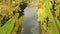 Aerial Shot Of river and trough and trees tinged in autumn colors