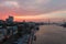 aerial shot of riverwalk along the Savannah River at sunset with hotels, restaurants, shops, Savannah City Hall