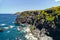 Aerial shot rocky coastline of Ponta Delgada Island. Azores