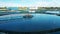 Aerial shot of round clarifiers at a sewage cleaning facility. Water management concept.