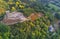 Aerial shot of a ruined castle of Balboa village in Bierzo, Leon, Spain surrounded by green trees