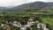 Aerial shot of  a rural town around mountains in Ecuador