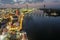 aerial shot of the Savannah River at sunset with the Talmadge Memorial Bridge, ships docked along the banks with restaurants,