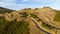 Aerial shot - Scenic view of Road at the peak at Bank Peninsula, Akaroa, New Zealand