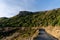 Aerial shot - Scenic view of Road at the peak at Bank Peninsula, Akaroa, New Zealand