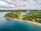 Aerial shot of small fire at the tropical coastline by Playa Arenillas in Costa Rica peninsula Papagayo coast guanacaste