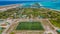 Aerial shot of the soccer pitch at the Maamigili tropical island at the Alif Dhaal Atoll at the indian ocean