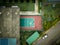 Aerial shot some people playing tennis in an old playground against the wall called fronton.