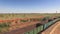 Aerial shot of stationary cargo train with empty wagons