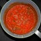 Aerial shot of a stewed tomato sauce with different spices of ingredients