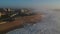 Aerial shot at sunset over beach and city of Povoa de Varzim, Portugal on foggy day