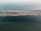 Aerial shot taken over the Fleet looking at Sandsfoot Beach and the ocean, Weymouth, Dorset, UK