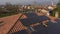 Aerial shot of technician maintenance of photovoltaic panel on home roof top