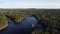 Aerial shot of thick vegetation surrounding small bodies of water