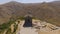 Aerial shot of tourists walking near old Garni temple, sightseeing in Armenia