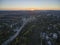 Aerial shot towards a sunset behind Kamianets-Podilskyi castle