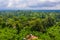 Aerial shot of trees at the Kilimanjaro National park forest in Tanzania under a cloudy sky