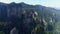 Aerial shot: Zhangjiajie sandstone peaks, steep mountains in forest park