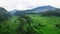 Aerial shots of Bali\'s scenic rice terraces & with background of mountain landscape morning