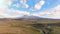 Aerial shots of Mt Tongariro and alpine stream with fresh water from the melting snow. Tongariro National Park. North