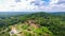 Aerial Side View Of A  Farmland Surrounded by Forest in the Day