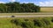 Aerial side view to highway road with cars, countryside rural la