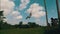 Aerial side view of woman on the swinging over beautiful rice fields background