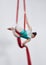 Aerial silk, acrobat and a woman in air for gymnastics performance, sports and balance. Behind athlete person or gymnast