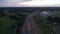 Aerial Slide above European Freeway at Sunset with Car traffic