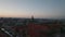 Aerial slide and pan footage of Christiansborg palace with tall tower against colourful twilight sky. Copenhagen