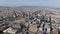 Aerial slide and pan footage of modern skyscraper Torre Glories. Metropolis cityscape at golden hour. Barcelona, Spain