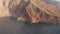 Aerial slider above coastline of mountain slope of island of El Hierro