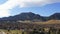 Aerial sliding shot of beautiful mountain town during the fall