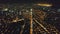 Aerial slow motion cityscape at night. Illuminated streets of Manila downtown at traffic city route