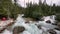 Aerial slow-motion of Meeting of the Waters Trail in Canadian Rockies mountain