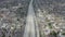 AERIAL: Slow Overhead Lookup over 110 Highway with little car traffic in Los Angeles, California on Cloudy Overcast Day