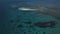Aerial: A small island, a lost island, beautiful azure water, an island for two, zanzibar, Maldives