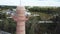 Aerial of smoke chimney surrounded by power plant buildings and green trees far away from the city. Stock footage