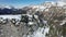 Aerial snow covered mountain peaks in alps at winter