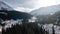 Aerial of snowy mountain range with snow